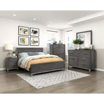 Commode haute Stella gris foncé dans une chambre