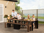 Table à manger extérieure extensible Transformer en noyer foncé, cadre noir – avec 5 rallonge(s), ensemble avec banc, mise en situation – Meubles TOCO
