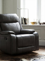 Chaise inclinable Lewis pivotante et berçante en gris foncé – mise en situation dans un salon – Meubles TOCO
