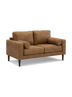 Causeuse Telora TOCO Meubles en similicuir caramel avec coussins cylindriques et pieds en bois foncé