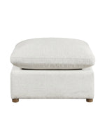 Ottoman Montrose de TOCO Meubles en tissu texturé beige clair avec pieds en bois, vue de face