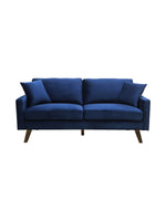 Canapé 3 places bleu roi en velours, pieds obliques en bois, par TOCO Meubles.