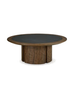 Table basse ronde Donta par TOCO Meubles avec plateau en bois foncé et centre noir mat sur pied cylindrique robuste