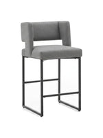 Tabouret de bar Myko par TOCO Meubles avec assise en tissu gris et structure en métal noir
