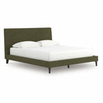 TOCO Meubles Alma bed in sage green fabric with a low profile and upholstered headboard, featuring black legs.