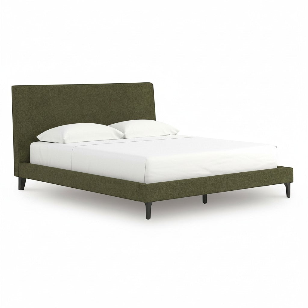TOCO Meubles Alma bed in sage green fabric with a low profile and upholstered headboard, featuring black legs.