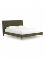 TOCO Meubles Alma bed in sage green fabric with a low profile and upholstered headboard, featuring black legs.