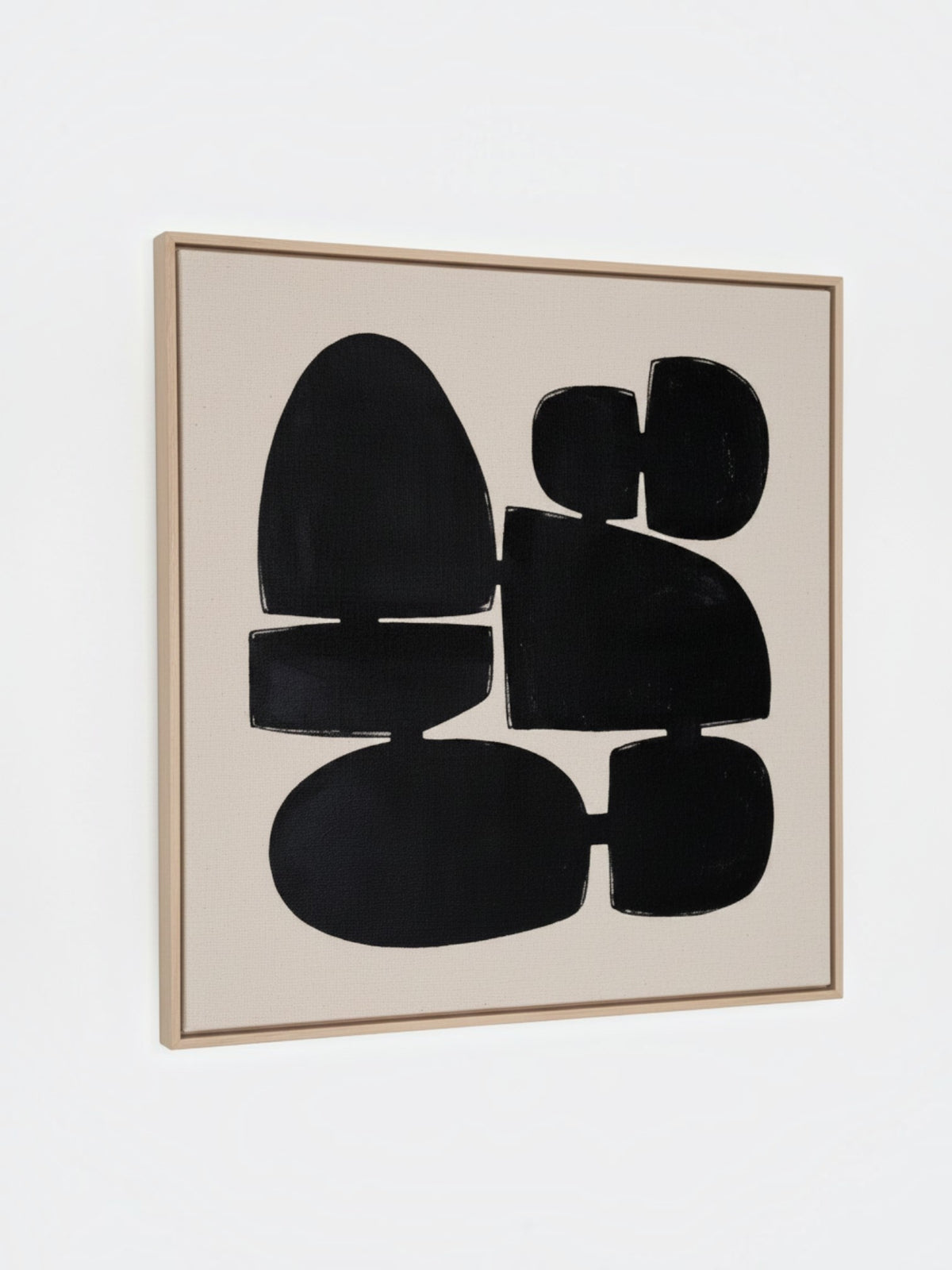 Cadre décoratif TOCO Meubles Pillars I avec formes géométriques abstraites noires sur fond beige et cadre en bois clair