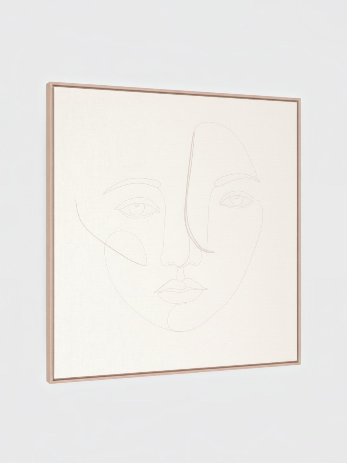 Cadre décoratif Dream I de TOCO Meubles avec un dessin au trait minimaliste d'un visage sur fond beige clair