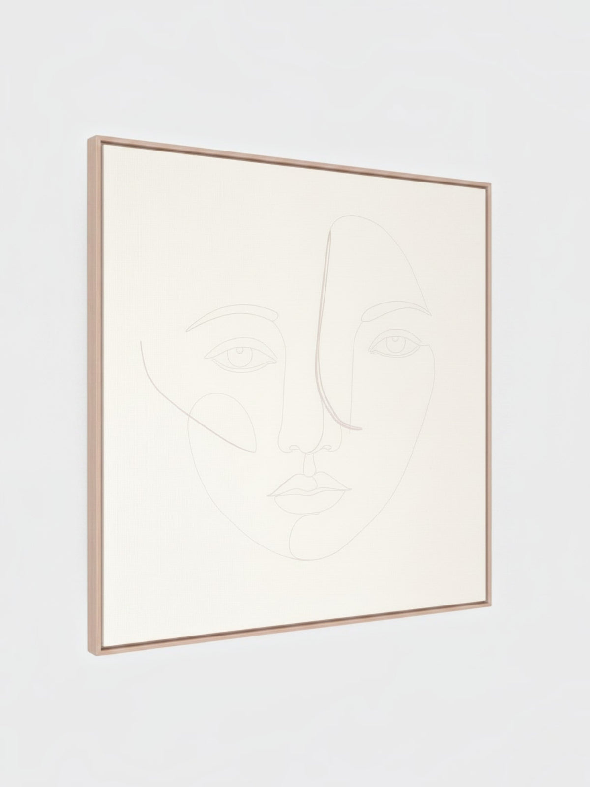 Cadre décoratif Dream I de TOCO Meubles avec un dessin au trait minimaliste d'un visage sur fond beige clair