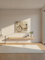 Cadre décoratif TOCO Meubles illustrant un vélo stylisé dans un intérieur minimaliste et lumineux