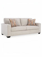 Canapé beige TOCO Meubles avec coussins décoratifs à motifs géométriques colorés et pieds en bois foncé