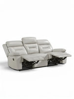 TOCO Meubles Sofa inclinable Monroe gris clair en cuir, 3 places, avec repose-pieds relevés.