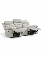 TOCO Meubles Sofa inclinable Monroe gris clair en cuir, 3 places, avec repose-pieds relevés.