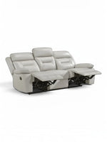 TOCO Meubles Sofa inclinable Monroe gris clair en cuir, 3 places, avec repose-pieds relevés.