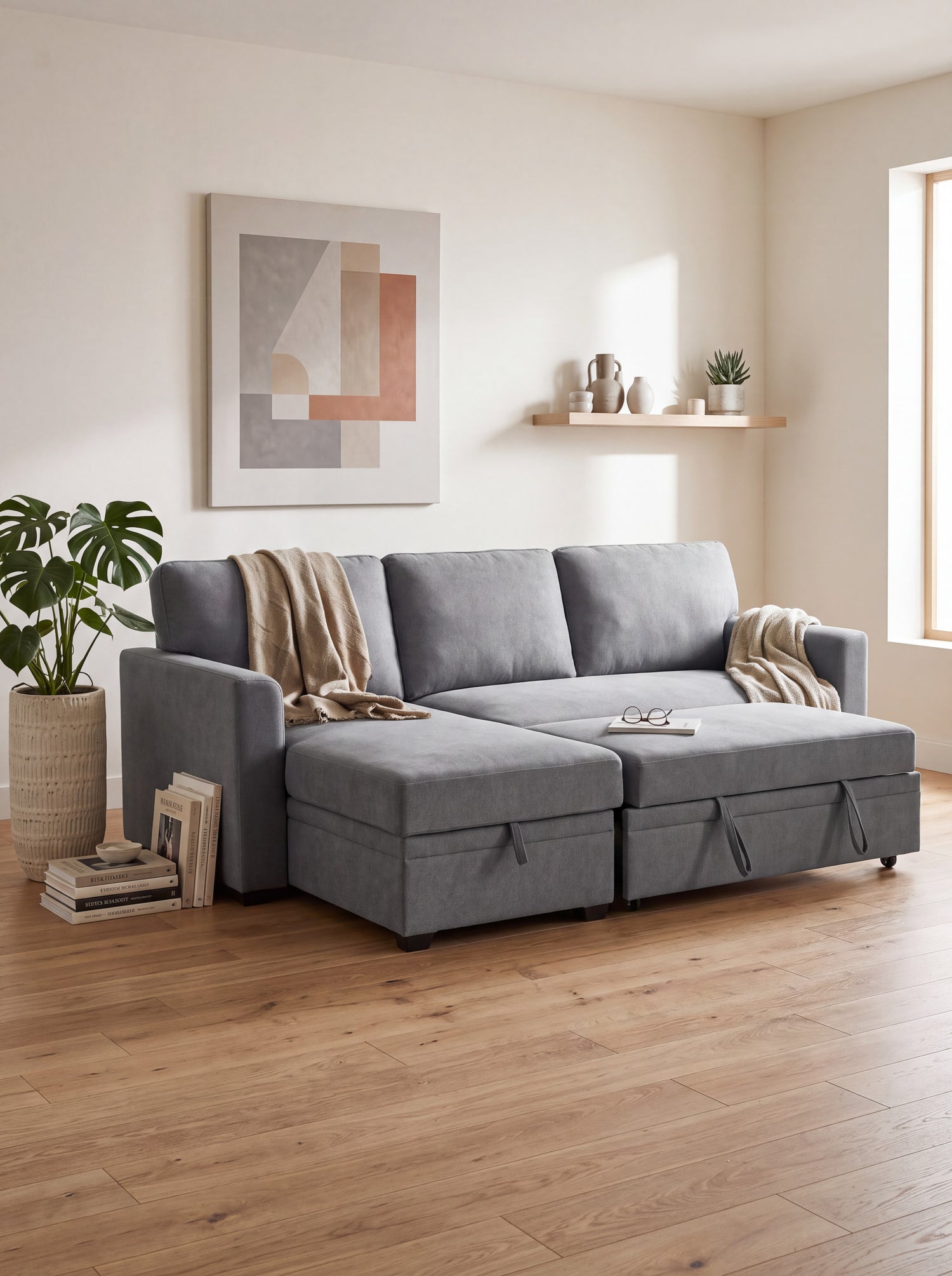 Canapé-lit d'angle Teni gris en tissu de TOCO Meubles, avec rangement intégré sous l'assise et la méridienne