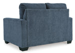 Toco Meubles Canapé-lit Jabari 2 places bleu marine en tissu texturé, design moderne avec pieds carrés noirs.