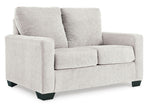 TOCO Meubles Canapé-lit Jabari 2 places gris clair en tissu texturé avec pieds noirs carrés.
