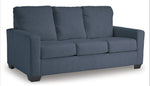TOCO Meubles Canapé-lit Jabari 3 places bleu marine en tissu texturé avec coussins moelleux et pieds carrés discrets.