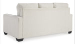 TOCO Meubles Canapé-lit Jabari 3 places crème texturé, pieds noirs carrés, design contemporain et décontracté.