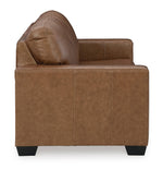 Canapé-lit Jelani en cuir brun de TOCO Meubles, design moderne avec coussin moelleux et coutures apparentes.