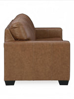 Canapé-lit Jelani en cuir brun de TOCO Meubles, design moderne avec coussin moelleux et coutures apparentes.