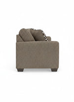Vue de profil du canapé-lit Kaya TOCO Meubles en tissu texturé taupe avec coussin à motifs géométriques
