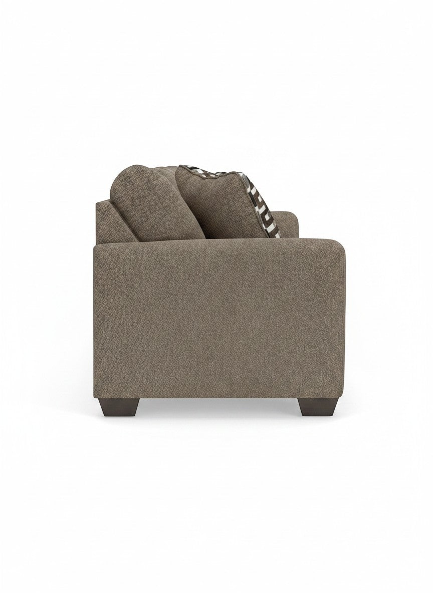 Vue de profil du canapé-lit Kaya TOCO Meubles en tissu texturé taupe avec coussin à motifs géométriques