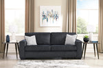 TOCO Meubles Sofa-lit Marcel gris foncé, 2 coussins décoratifs blancs et gris, design moderne.