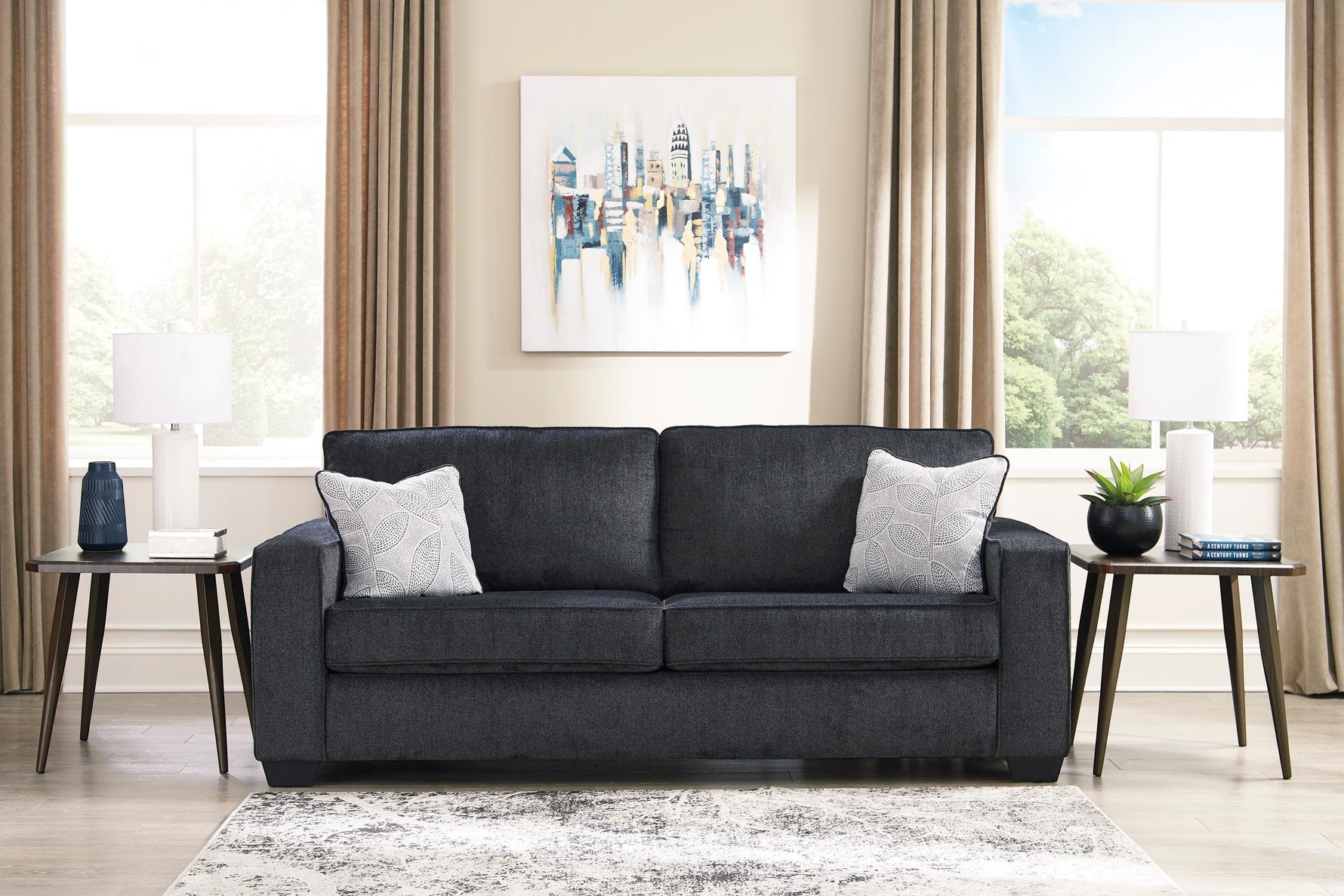 TOCO Meubles Sofa-lit Marcel gris foncé, 2 coussins décoratifs blancs et gris, design moderne.