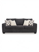Canapé-lit Muna TOCO Meubles anthracite en tissu, avec 4 coussins décoratifs, design moderne et confortable.