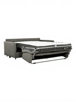 TOCO Meubles Canapé-lit Omari gris en tissu, convertible en lit avec matelas blanc.