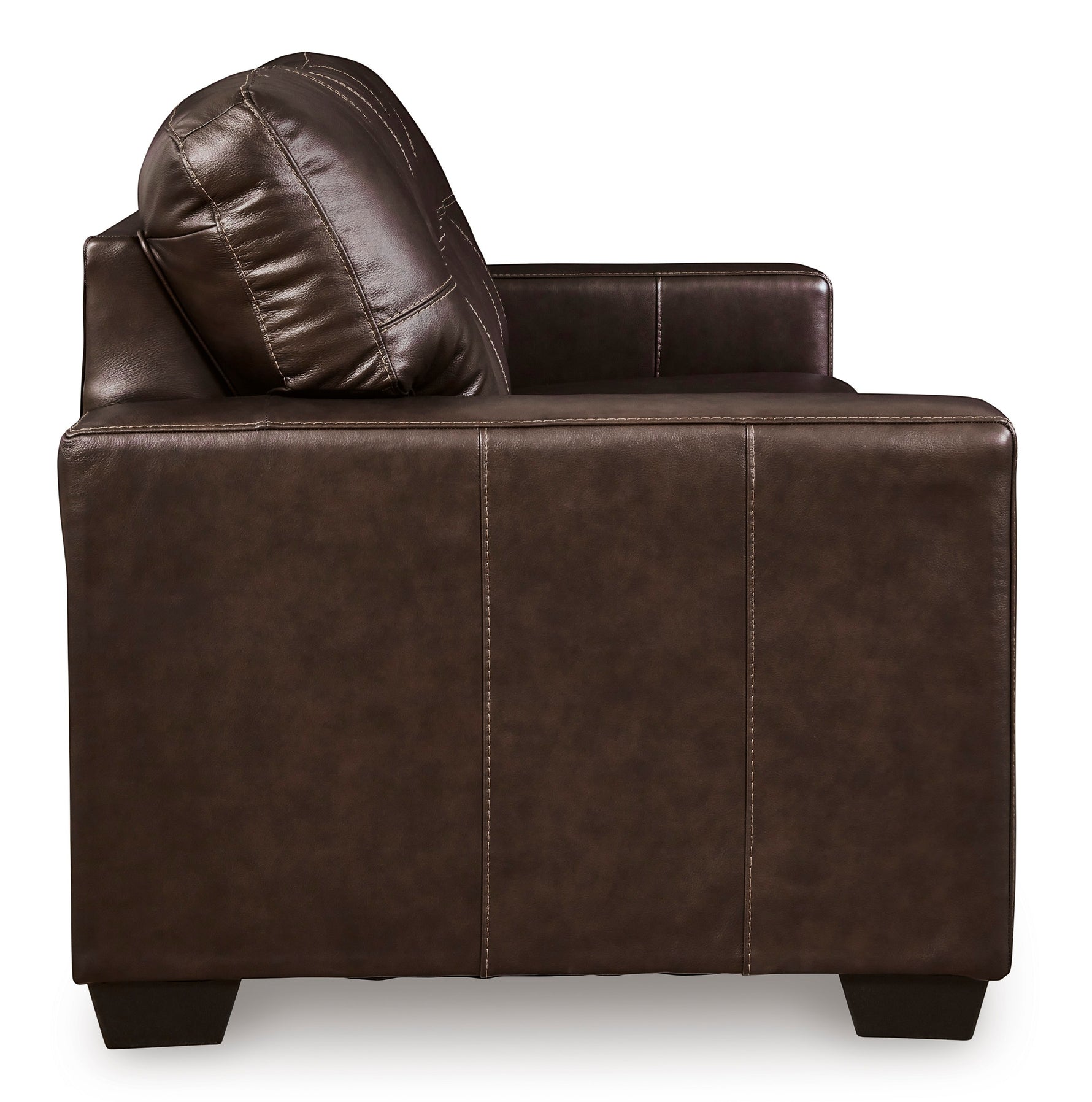 Canapé-lit Sacha marron foncé en cuir et aspect-cuir avec surpiqûres contrastantes et coussin assorti. TOCO Meubles.