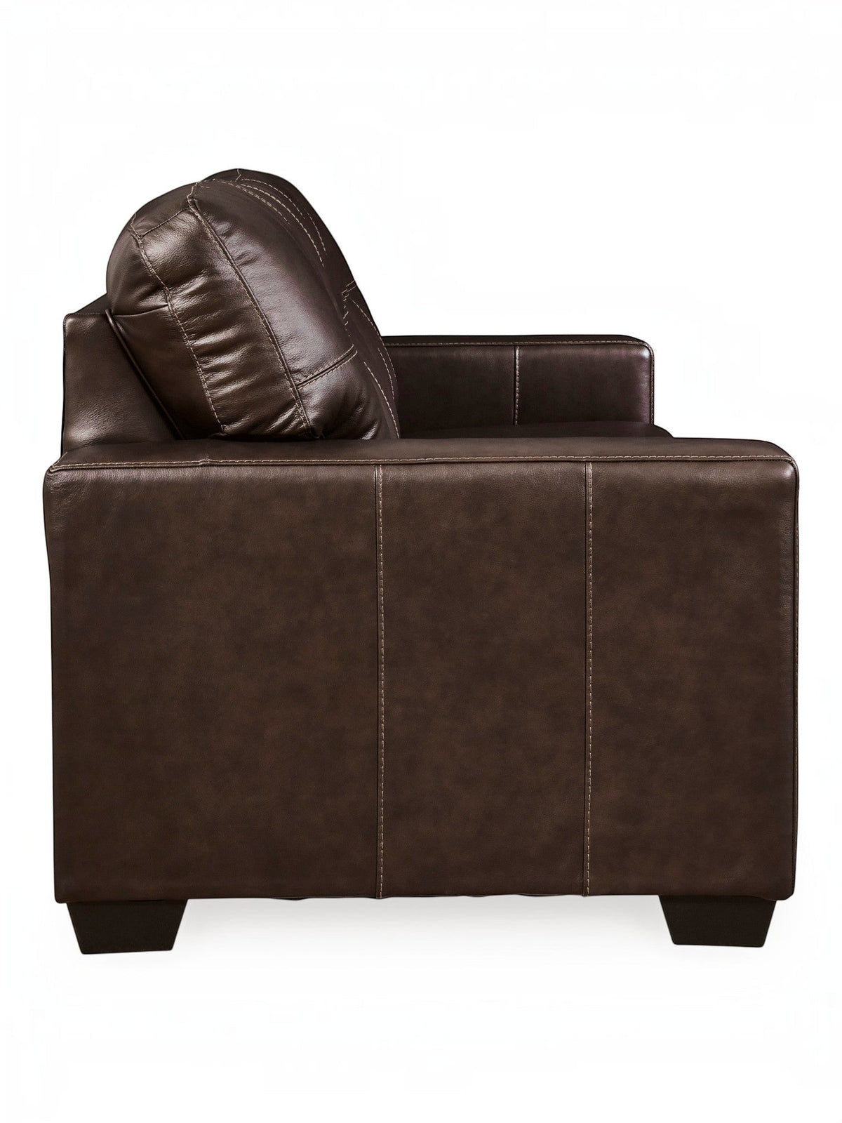 Canapé-lit Sacha marron foncé en cuir et aspect-cuir avec surpiqûres contrastantes et coussin assorti. TOCO Meubles.