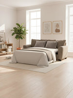 Canapé-lit convertible TOCO Meubles Kaya en tissu taupe texturé, déplié en lit dans un salon lumineux et moderne.