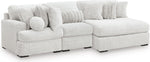 TOCO Meubles Canapé modulaire blanc en tissu texturé avec chaise longue et coussins décoratifs.