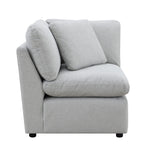 TOCO Meubles - Canapé modulaire gris clair en tissu texturé, avec coussins moelleux et accoudoirs inclinés.