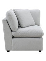 TOCO Meubles - Canapé modulaire gris clair en tissu texturé, avec coussins moelleux et accoudoirs inclinés.