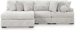 TOCO Meubles Canapé modulaire gris clair en tissu texturé avec chaise longue et coussins assortis.