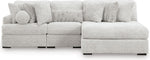 TOCO Meubles Canapé modulaire Nuage gris clair en tissu texturé avec chaise longue et coussins assortis.