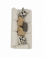 Canapé TOCO Meubles Moka couleur quartz avec coussins décoratifs à motifs géométriques et unis, vue de dessus