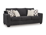 TOCO Meubles Sofa-lit Muna gris foncé, 3 places, avec 4 coussins décoratifs inclus.