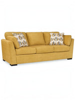 Canapé TOCO Meubles Owick jaune tournesol avec coussins décoratifs à motifs géométriques sur fond blanc