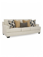 Canapé TOCO Meubles Moka couleur quartz avec coussins décoratifs géométriques et unis sur fond blanc