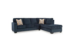 TOCO Meubles Sofa sectionnel Toscana bleu marine en tissu avec coussins décoratifs géométriques.