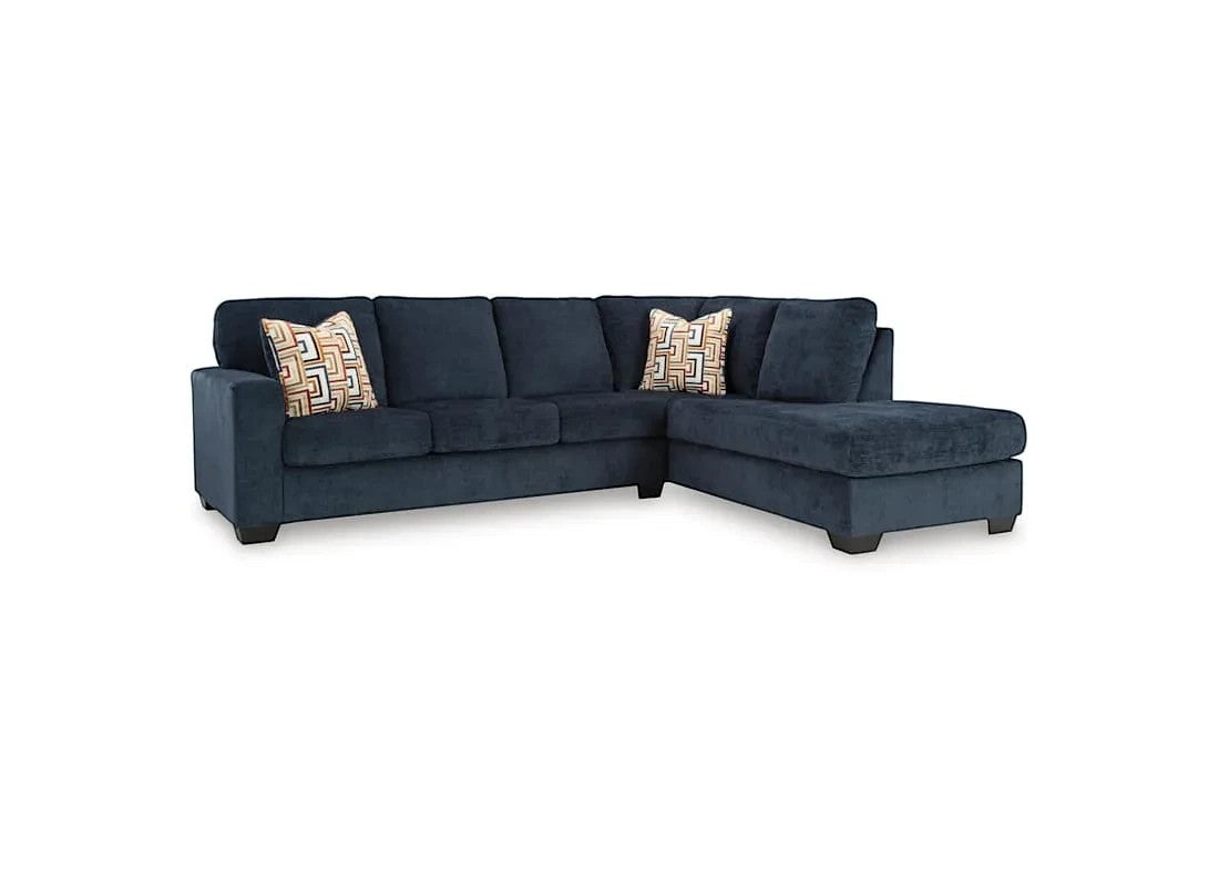 TOCO Meubles Sofa sectionnel Toscana bleu marine en tissu avec coussins décoratifs géométriques.