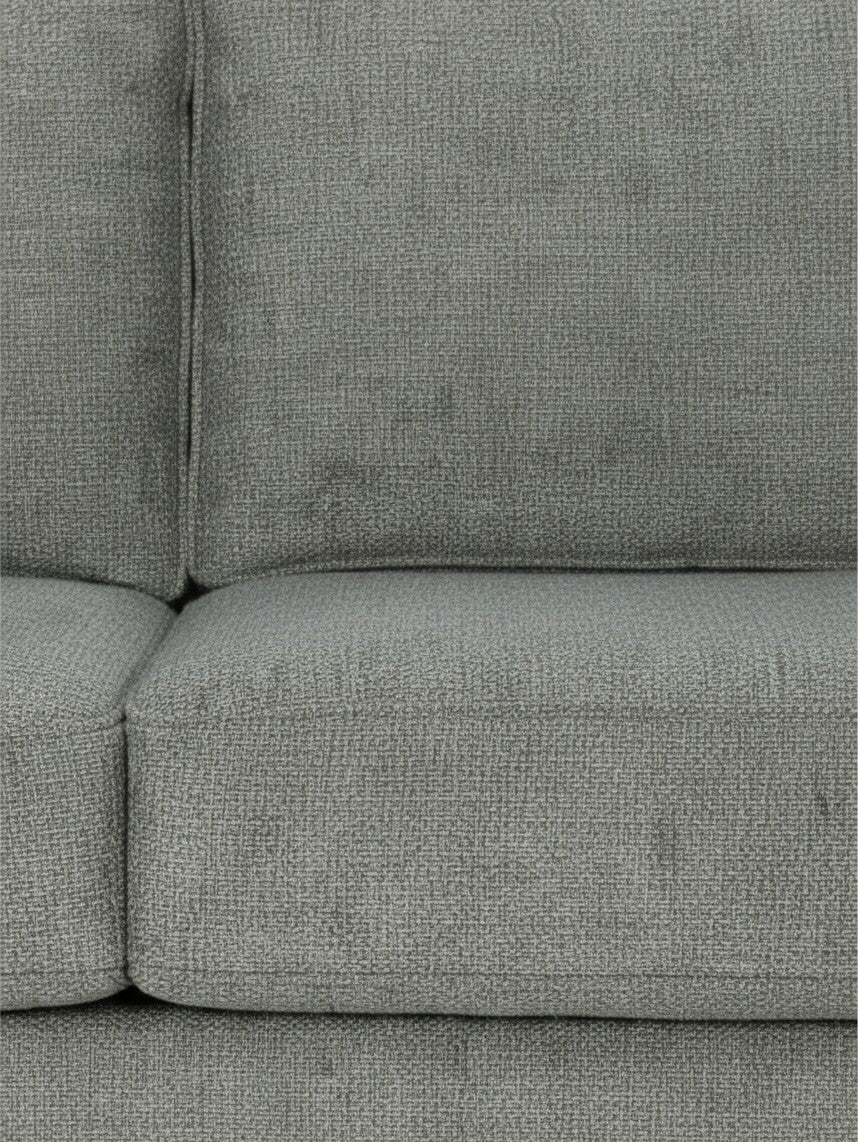 Gros plan sur le tissu texturé gris anthracite du canapé sectionnel Zela de TOCO Meubles