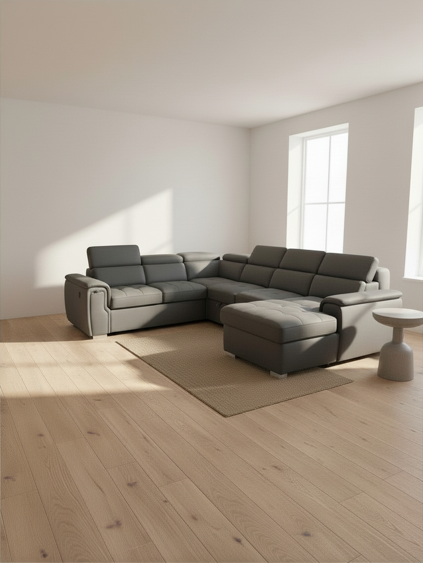 Canapé sectionnel-lit gris moderne de TOCO Meubles dans un salon lumineux avec parquet en bois clair