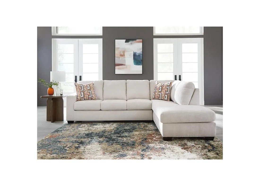 TOCO Meubles Sofa sectionnel Toscana blanc cassé en tissu, avec coussins décoratifs géométriques.