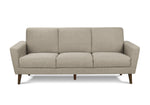 Canapé Tano beige en tissu de TOCO Meubles, 3 places, pieds en bois obliques, style moderne.